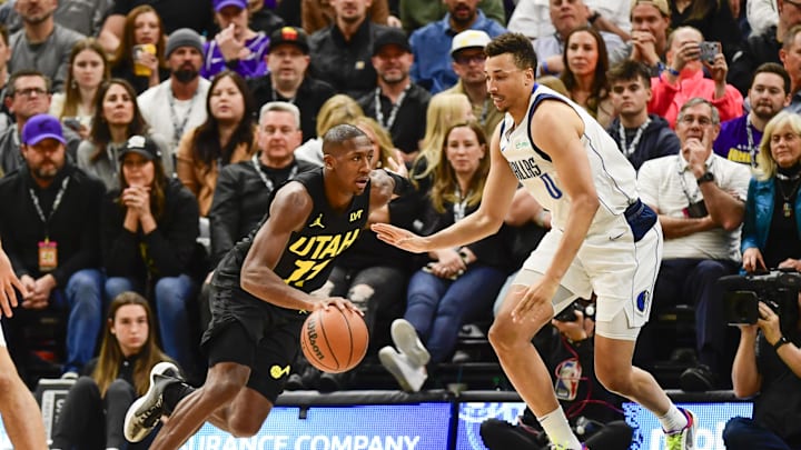 Jan 1, 2024; Salt Lake City, Utah, USA; Utah Jazz guard Kris Dunn (11) drives around Dallas
