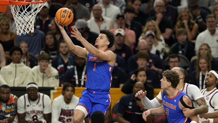 Apr 5, 2025; San Antonio, TX, USA; Florida Gators guard Walter Clayton Jr. (1) shoots the ball against the Auburn Tigers during the first half in the semifinals of the men's Final Four of the 2025 NCAA Tournament at Alamodome. Mandatory Credit: Scott Wachter-Imagn Images