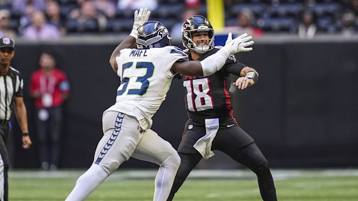 Oct 20, 2024; Atlanta, Georgia, USA; Seattle Seahawks linebacker Boye Mafe (53) hits Atlanta Falcons quarterback Kirk Cousins (18) causing a fumble that is returned for a Seahawks touchdown during the second half at Mercedes-Benz Stadium. Mandatory Credit: Dale Zanine-Imagn Images