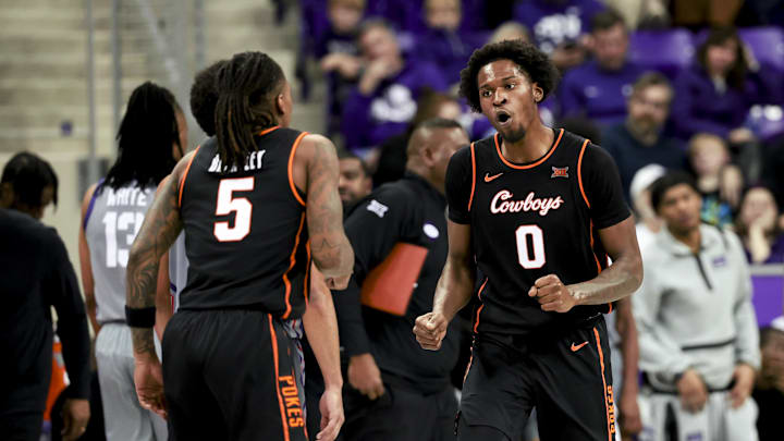 Feb 12, 2025; Fort Worth, Texas, USA; Oklahoma State Cowboys forward Marchelus Avery (0) celebrates with Oklahoma State Cowboys guard Khalil Brantley (5) during the second half against the TCU Horned Frogs at Ed and Rae Schollmaier Arena. Mandatory Credit: Kevin Jairaj-Imagn Images