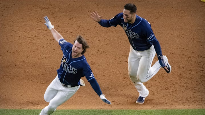 Oct 24, 2020; Arlington, Texas, USA; The Tampa Bay Rays center fielder Kevin Kiermaier (39) and right fielder Brett Phillips (14) celebrate Phillips hitting the game winning two run walk off single against the Los Angeles Dodgers during the ninth inning in game four of the 2020 World Series at Globe Life Field. Mandatory Credit: Jerome Miron-Imagn Images Oct 24, 2020; Arlington, Texas, USA; The Tampa Bay Rays center fielder Kevin Kiermaier (39) and right fielder Brett Phillips (14) celebrate Phillips hitting the game winning two run walk off single against the Los Angeles Dodgers during the ninth inning in game four of the 2020 World Series at Globe Life Field. Mandatory Credit: Jerome Miron-Imagn Images