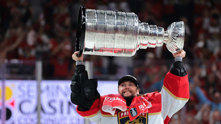 Jun 17, 2025; Sunrise, Florida, USA; Florida Panthers goaltender Sergei Bobrovsky (72) hoists the Stanley Cup after winning game six of the 2025 Stanley Cup Final against the Edmonton Oilers at Amerant Bank Arena. 