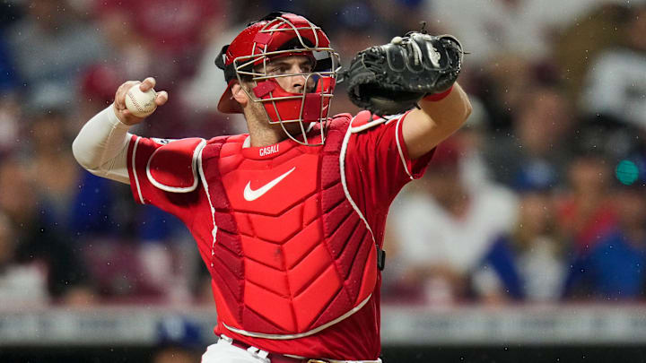 Cincinnati Reds catcher Curt Casali (12) returns the ball in the ninth inning of the MLB National League game between the Cincinnati Reds and the LA Dodgers at Great American Ball Park in downtown Cincinnati on Tuesday, June 6, 2023. The Reds won 9-8 on a walk-off, bases loaded, single off the bat of shortstop Matt McLain (9) in the bottom of the ninth. Cincinnati Reds catcher Curt Casali (12) returns the ball in the ninth inning of the MLB National League game between the Cincinnati Reds and the LA Dodgers at Great American Ball Park in downtown Cincinnati on Tuesday, June 6, 2023. The Reds won 9-8 on a walk-off, bases loaded, single off the bat of shortstop Matt McLain (9) in the bottom of the ninth.