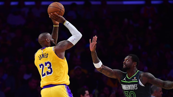 Apr 30, 2025; Los Angeles, California, USA; Los Angeles Lakers forward LeBron James (23) shoots against Minnesota Timberwolves forward Julius Randle (30) during the second half in game five of first round for the 2025 NBA Playoffs at Crypto.com Arena. Mandatory Credit: Gary A. Vasquez-Imagn Images