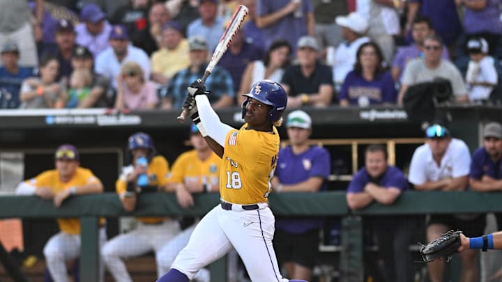 LSU Tigers first baseman Tre' Morgan (18) hits a single RBI against the Florida Gators in the second inning at Charles Schwab Field Omaha in 2023.