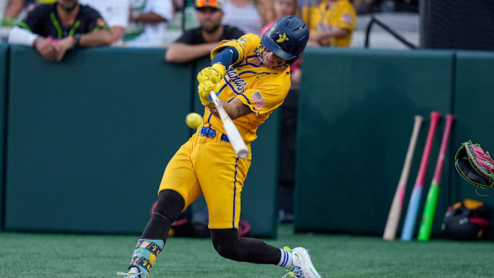Jun 7, 2025; Charlotte, NC, USA; Savannah Bananas utility KJ Jackson (4) makes a hit during the exhibition game against the Party Animals at Bank of America Stadium. Mandatory Credit: Jim Dedmon-Imagn Images