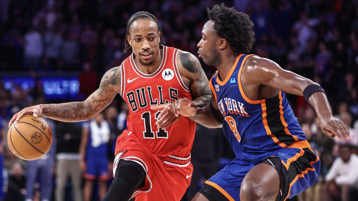 Apr 14, 2024; New York, New York, USA;  Chicago Bulls forward DeMar DeRozan (11) looks to drive past New York Knicks forward OG Anunoby (8) in the fourth quarter at Madison Square Garden. Mandatory Credit: Wendell Cruz-USA TODAY Sports
