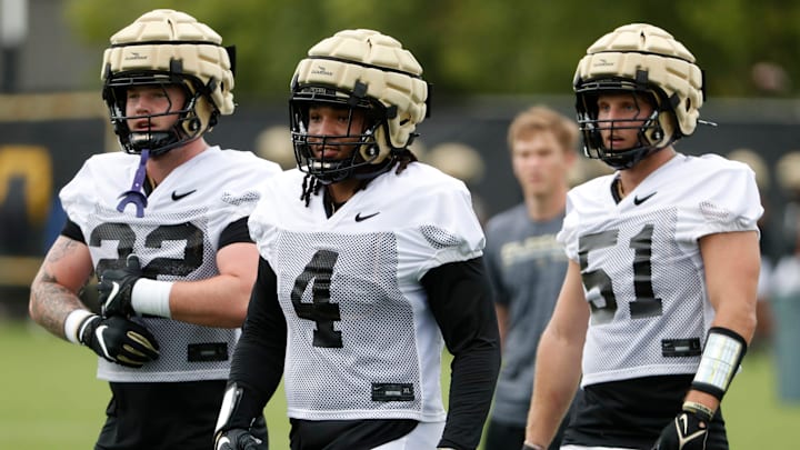 Purdue Boilermakers linebackers Owen Davis (22), Kydran Jenkins (4) and Landon Drennan (51) 