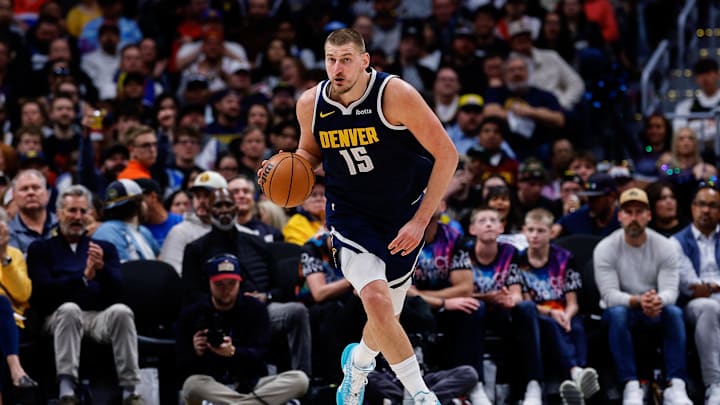 Denver Nuggets center Nikola Jokic (15) dribbles the ball up court in the third quarter against the Minnesota Timberwolves