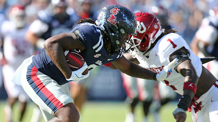 Oct 26, 2024; Oxford, Mississippi, USA; Mississippi Rebels tight end Dae'Quan Wright (8) runs after a catch as Oklahoma Sooners linebacker Dasan McCullough (1) makes the tackle during the first half at Vaught-Hemingway Stadium. Mandatory Credit: Petre Thomas-Imagn Images