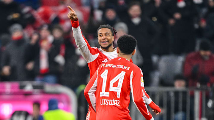 Michael Olise and Luis Diaz celebrating during Bayern Munich's 8-1 win against Wolfsburg.