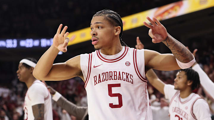 Jan 3, 2026; Fayetteville, Arkansas, USA; Arkansas Razorbacks guard Darius Acuff Jr (5) reacts to a made three by a teammate during the second half against the Tennessee Volunteers at Bud Walton Arena. Mandatory Credit: Nelson Chenault-Imagn Images