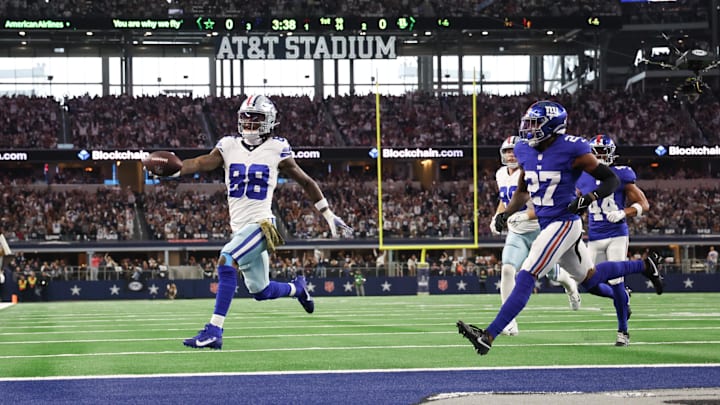 Nov 12, 2023; Arlington, Texas, USA;  Dallas Cowboys wide receiver CeeDee Lamb runs past New York Giants safety Jason Pinnock and scores a touchdown during the first quarter at AT&T Stadium. 