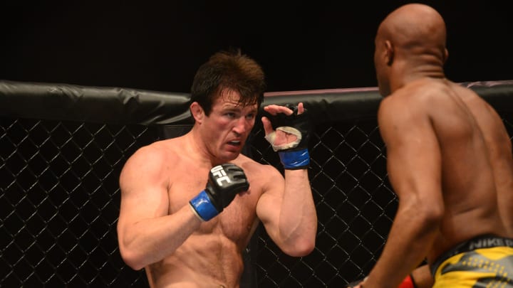 Jul. 7, 2012; Las Vegas, NV, USA; UFC fighter Chael Sonnen (left) against Anderson Silva during a middleweight bout in UFC 148 at the MGM Grand Garden Arena. Mandatory Credit: Mark J. Rebilas-USA TODAY Sports