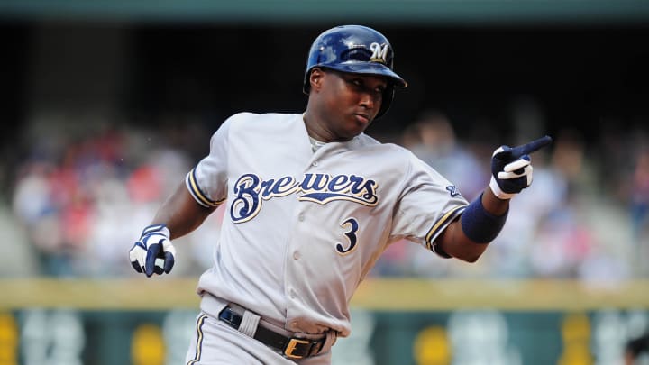 July 28, 2013; Denver, CO, USA; Milwaukee Brewers first baseman Yuniesky Betancourt (3) reacts as he July 28, 2013; Denver, CO, USA; Milwaukee Brewers first baseman Yuniesky Betancourt (3) reacts as he