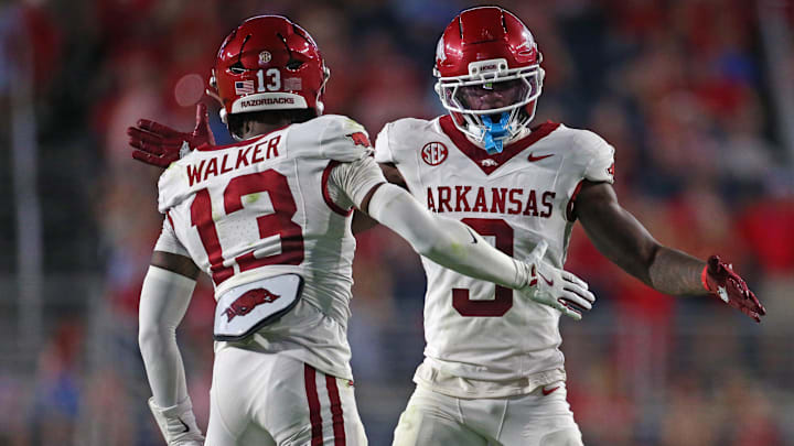 Arkansas Razorback defensive back Larry Worth III (3) and defensive back Kani Walker (13) react during the second quarter against the Mississippi Rebels at Vaught-Hemingway Stadium.