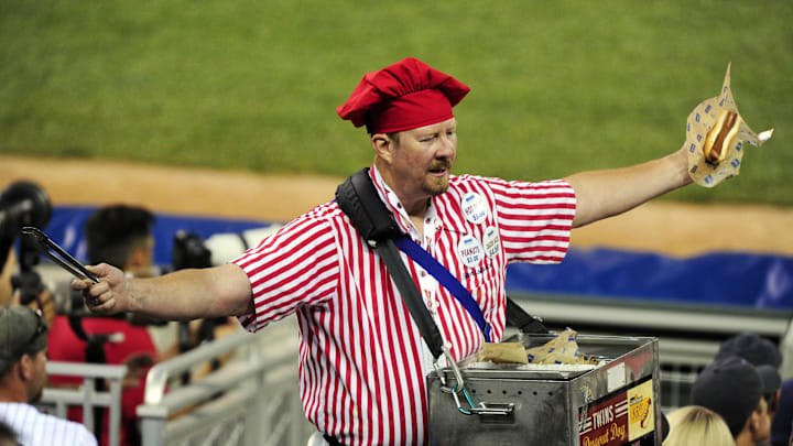 Jul 15, 2014; Minneapolis, MN, USA; A hot dog vendor works along the third base line during the 2014 MLB All Star Game at Target Field. Mandatory Credit: Jeff Curry-Imagn Images Jul 15, 2014; Minneapolis, MN, USA; A hot dog vendor works along the third base line during the 2014 MLB All Star Game at Target Field. Mandatory Credit: Jeff Curry-Imagn Images