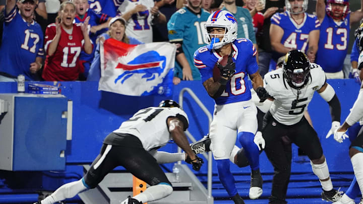 Sep 23, 2024; Orchard Park, New York, USA; Buffalo Bills wide receiver Khalil Shakir (10) runs with the ball after making a catch for a touchdown against Jacksonville Jaguars cornerback 	Christian Braswell (21) during the first half at Highmark Stadium. Mandatory Credit: Gregory Fisher-Imagn Images