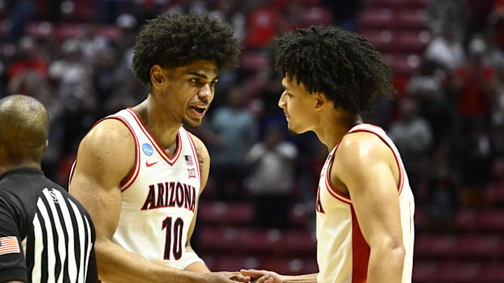 Mar 22, 2026; San Diego, CA, USA; Arizona Wildcats forward Koa Peat (10) celebrates with guard Brayden Burries (5) after defeating the Utah State Aggies during a second round game of the men's 2026 NCAA Tournament at Viejas Arena. Mandatory Credit: Denis Poroy-Imagn Images