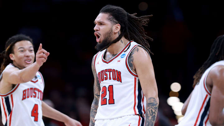 Houston's Emanuel Sharp (21) and Kingston Flemings celebrate during a second-round game in the NCAA men's basketball tournament between Houston Cougars and Texas A&M Aggies at Paycom Center in Oklahoma City, Saturday March 21, 2026.