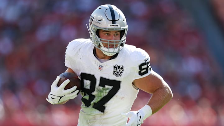 Dec 8, 2024; Tampa, Florida, USA; Las Vegas Raiders tight end Michael Mayer (87) runs with the ball against the Tampa Bay Buccaneers in the second quarter at Raymond James Stadium. Mandatory Credit: Nathan Ray Seebeck-Imagn Images