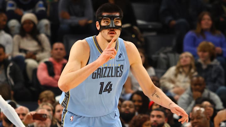 Memphis Grizzlies center Zach Edey (14) reacts after a basket 