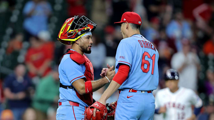 Apr 18, 2026; Houston, Texas, USA; St. Louis Cardinals pitcher Riley O'Brien (61) is congratulated by St. Louis Cardinals catcher Ivan Herrera (48) after the final out against the Houston Astros during the ninth inning at Daikin Park. Mandatory Credit: Erik Williams-Imagn Images