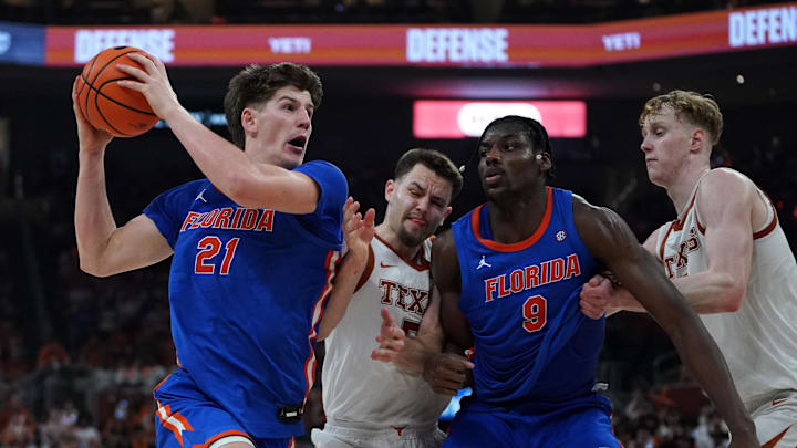 Feb 25, 2026; Austin, Texas, USA; Florida Gators forward Alex Condon (21) drives the ball to the basket against Texas Longhorns forward Camden Heide (5) during the second half at Moody Center.
