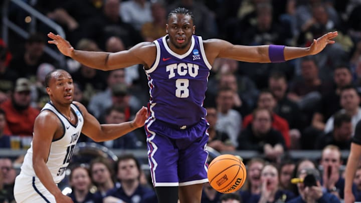 Mar 22, 2024; Indianapolis, IN, USA; TCU Horned Frogs center Ernest Udeh Jr. (8) reacts to a play during the second half against the Utah State Aggies in the first round of the 2024 NCAA Tournament at Gainbridge FieldHouse. Mandatory Credit: Trevor Ruszkowski-Imagn Images