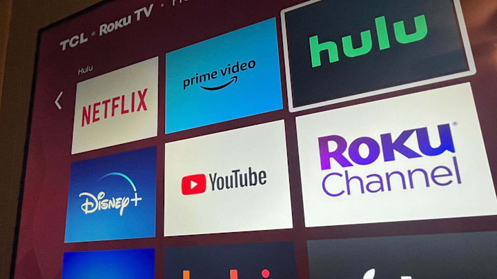 Multiple streaming services appear on a Roku TV.