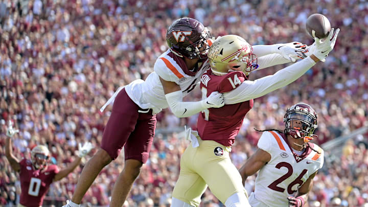 Oct 7, 2023; Tallahassee, Florida, USA; Florida State Seminoles wide receiver Keon Coleman (4) fails to secure a catch as Virginia Tech Hokies cornerback Mansoor Delane (4) defends during the first half at Doak S. Campbell Stadium. Mandatory Credit: Melina Myers-Imagn Images