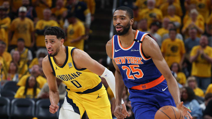New York Knicks forward Mikal Bridges dribbles the ball defended by Indiana Pacers guard Tyrese Haliburton. Mandatory Credit: Trevor Ruszkowski-Imagn Images