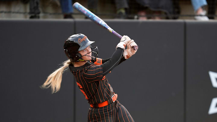 Oklahoma State Cowgirls infielder Rosie Davis hits a home run.