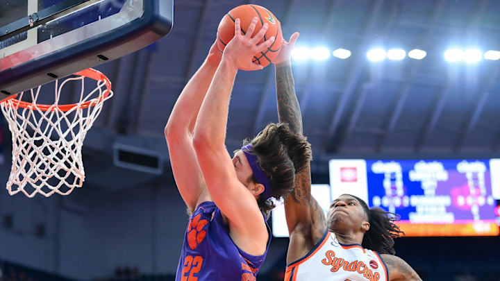 Dec 31, 2025; Syracuse, New York, USA; Syracuse Orange forward Donnie Freeman (1) blocks the shot of Clemson Tigers center Carter Welling (22) during the first half at the JMA Wireless Dome. Mandatory Credit: Rich Barnes-Imagn Images