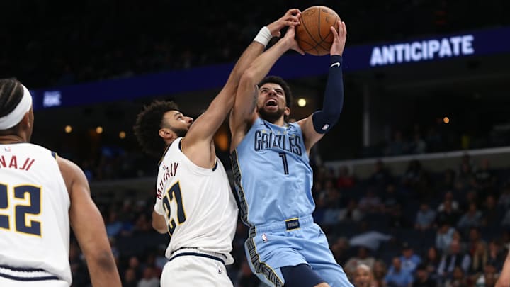 Nov 19, 2024; Memphis, Tennessee, USA; Memphis Grizzlies guard Scotty Pippen Jr. (1) drives to the basket as Denver Nuggets guard Jamal Murray (27) defends during the second half at FedExForum. Mandatory Credit: Petre Thomas-Imagn Images