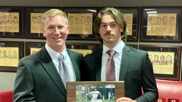 Clark Jinks of Alfa Insurance presents Braden Booth the 2024 Mr. Baseball Award from the Alabama Sports Writers Association.