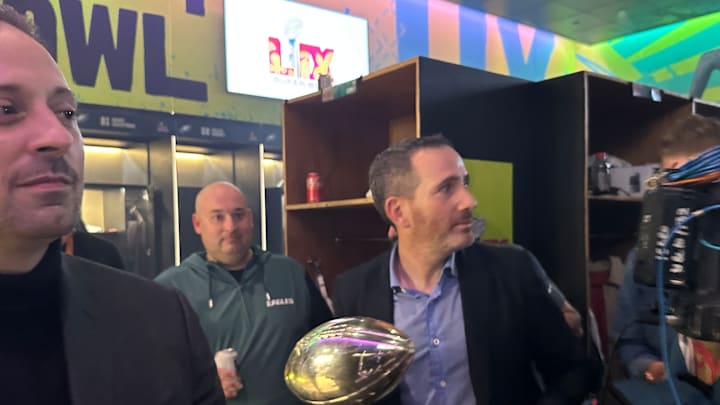 General manager Howie Roseman works his way through the Eagles locker room after winning Super Bowl LIX against the Kansas City Chiefs.