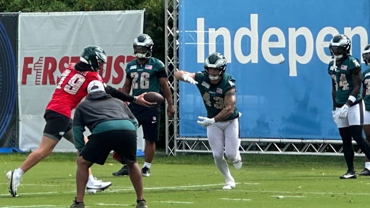 Eagles rookie QB Kyle McCord hands off the football to fullback Ben VanSumeren on July 26, 2025. Eagles rookie QB Kyle McCord hands off the football to fullback Ben VanSumeren on July 26, 2025.