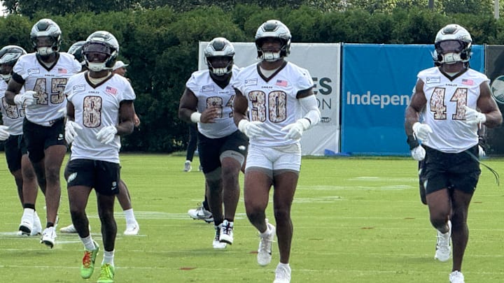 Eagles first-round rookie pick Jihaad Campbell (No. 30) wamrs up for a training camp practice. Eagles first-round rookie pick Jihaad Campbell (No. 30) wamrs up for a training camp practice.