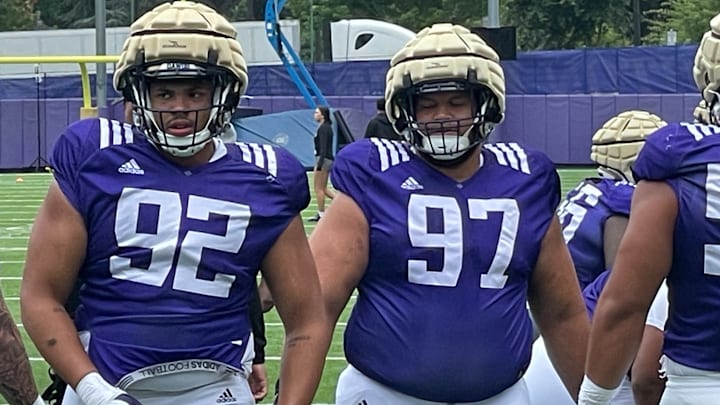 Bryce Butler and Logan Sagapolu go through a spring drill on the East field. 