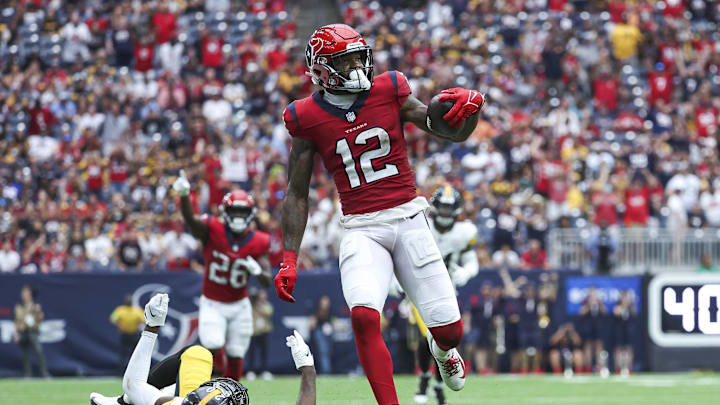 Houston Texans wide receiver Nico Collins (12) runs with the ball.