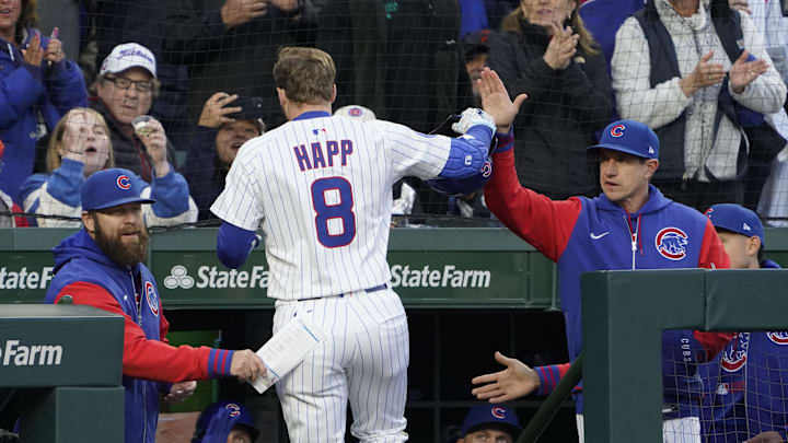 Chicago, Illinois, USA; Chicago Cubs outfielder Ian Happ (8) is greeted by manager Craig Counsell (11) after hitting a two-run home run against the San Francisco Giants during the third inning at Wrigley Field.