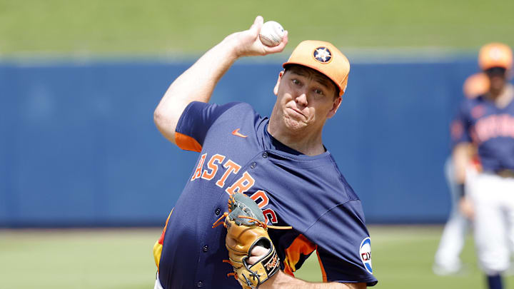 Feb 22, 2025; West Palm Beach, Florida, USA; Houston Astros pitcher Ryan Gusto (67) throws a warmup pitch before the first inning against the Washington Nationals at CACTI Park of the Palm Beaches. 