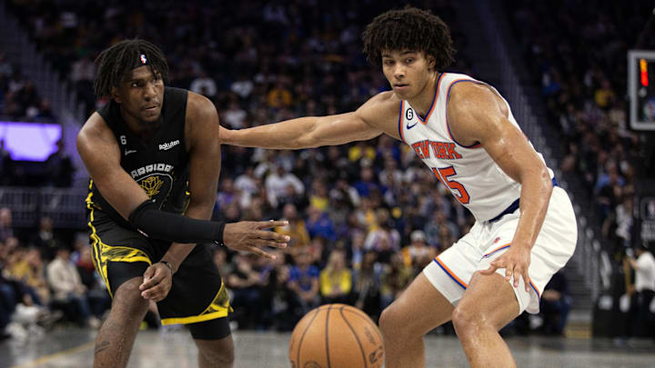 Nov 18, 2022; San Francisco, California, USA; Golden State Warriors forward Kevon Looney (5) passes around New York Knicks center Jericho Sims (45) during the fourth quarter at Chase Center. Mandatory Credit: D. Ross Cameron-USA TODAY Sports Nov 18, 2022; San Francisco, California, USA; Golden State Warriors forward Kevon Looney (5) passes around New York Knicks center Jericho Sims (45) during the fourth quarter at Chase Center. Mandatory Credit: D. Ross Cameron-USA TODAY Sports