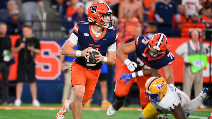 Oct 18, 2025; Syracuse, New York, USA; Syracuse Orange quarterback Luke Carney (11) looks to pass against the Pittsburgh Panthers during the second half at the JMA Wireless Dome. Mandatory Credit: Rich Barnes-Imagn Images