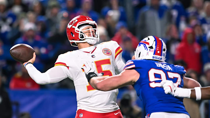 Nov 2, 2025; Orchard Park, New York, USA; Kansas City Chiefs quarterback Patrick Mahomes (15) throws a pass under pressure from Buffalo Bills defensive end Joey Bosa (97) in the fourth quarter at Highmark Stadium. Mandatory Credit: Mark Konezny-Imagn Images