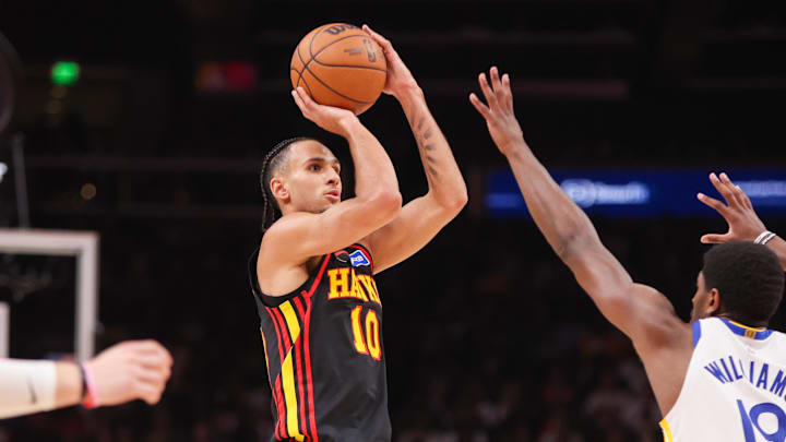 Mar 21, 2026; Atlanta, Georgia, USA; Atlanta Hawks forward Zaccharie Risacher (10) shoots against the Golden State Warriors in the second quarter at State Farm Arena. Mandatory Credit: Brett Davis-Imagn Images