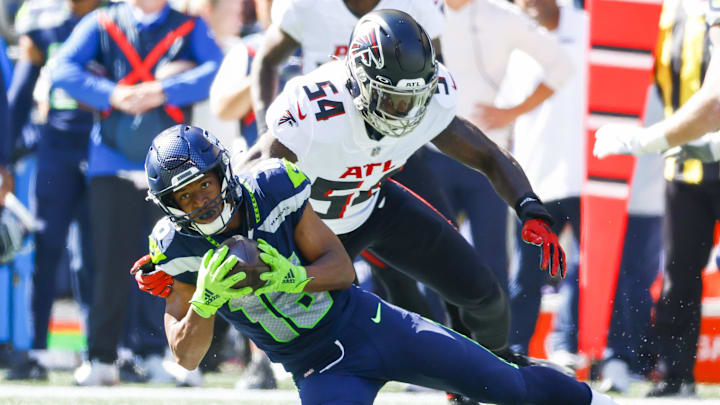 Sep 25, 2022; Seattle, Washington, USA; Seattle Seahawks wide receiver Tyler Lockett (16) catches a pass against Atlanta Falcons linebacker Rashaan Evans (54) during the first quarter at Lumen Field. Sep 25, 2022; Seattle, Washington, USA; Seattle Seahawks wide receiver Tyler Lockett (16) catches a pass against Atlanta Falcons linebacker Rashaan Evans (54) during the first quarter at Lumen Field.