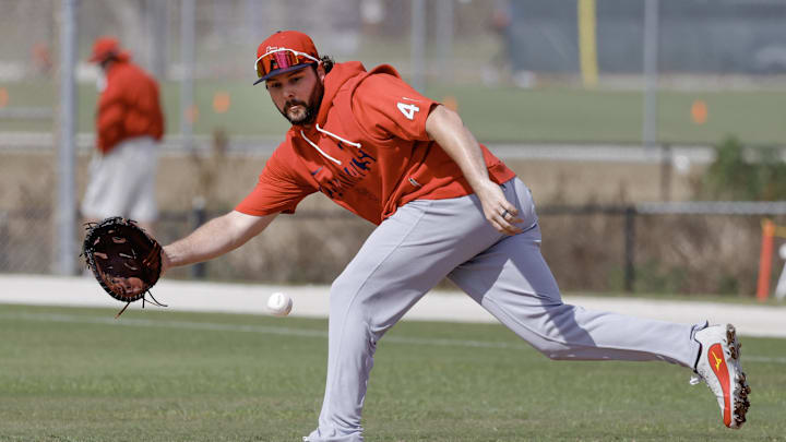 Feb 16, 2026; Jupiter, FL, USA;  St. Louis Cardinals first baseman Alec Burleson (41) fields a ground ball during spring training workouts at Roger Dean Stadium. Mandatory Credit: Reinhold Matay-Imagn Images