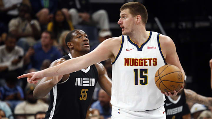 Denver Nuggets center Nikola Jokic (15) gives direction as Memphis Grizzlies center Trey Jemison (55) defends during the second half at FedExForum. Mandatory Credit: Petre Thomas-Imagn Images